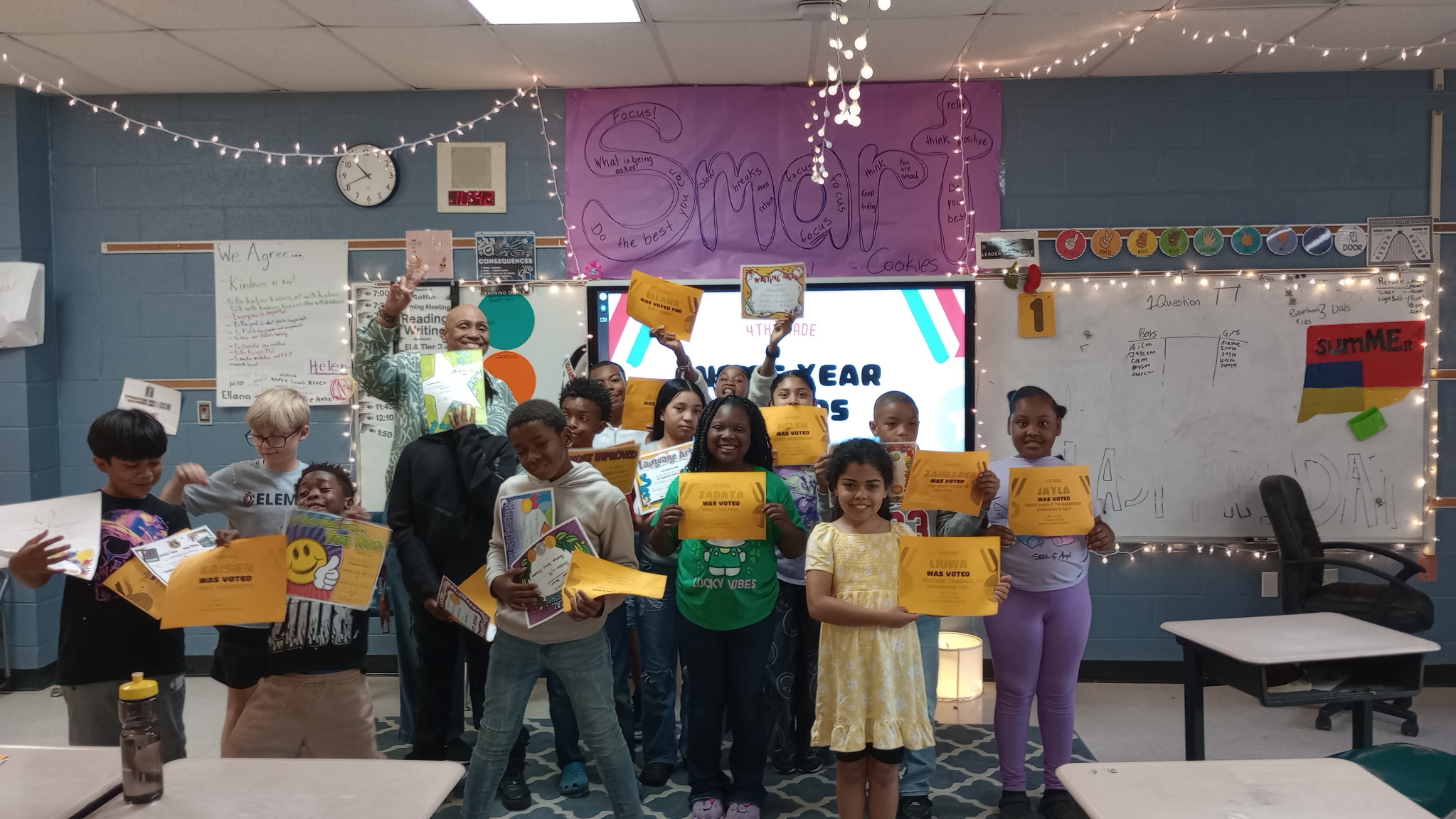 Mignon Charvat with students and awards